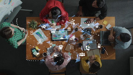 A diverse group of professionals collaborates on a dynamic business project, utilizing modern...