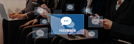 Individuals in a business setting engage in feedback discussions using various devices while...