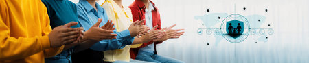 A diverse group of individuals clapping and showing engagement in a casual setting, representing...