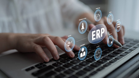 Professional Business Person Using Laptop with Innovative ERP Technology Interface and Data Icons...