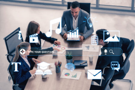 Business team collaborating in a modern office setting with digital technology, presentations, and...