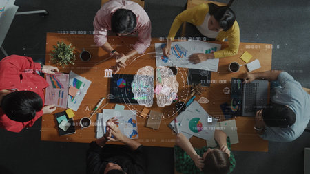 A group of diverse professionals engaged in a collaborative brainstorming session, utilizing...