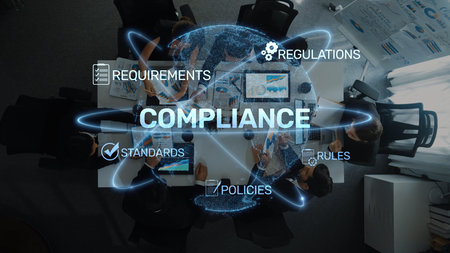 Aerial view of a diverse group of professionals working on compliance strategies in an office...
