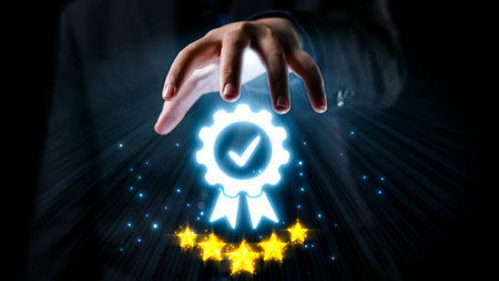 A hand reaches out to a glowing badge symbolizing quality and excellence. This image represents achievement and customer satisfaction, conveying a message of trust and recognition in business.の写真素材