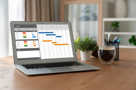 Project planning software for modish business project management on the computer screen showing...
