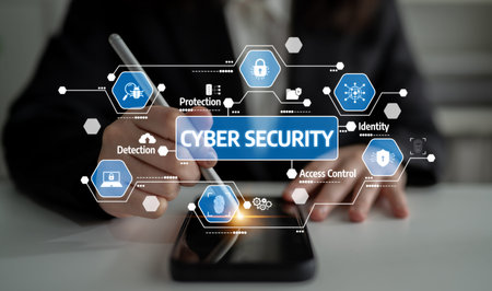 A person uses a stylus on a smartphone to explore various cyber security concepts, emphasizing...
