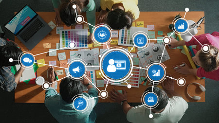 Engaging overhead view of a diverse team brainstorming and strategizing marketing plans using...