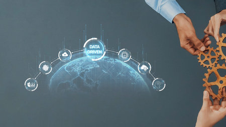 This image showcases hands working together with gears and a visual representation of data-driven...
