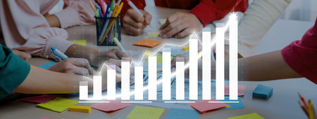 A diverse team collaborates in a business meeting, analyzing data and brainstorming ideas. The scene...