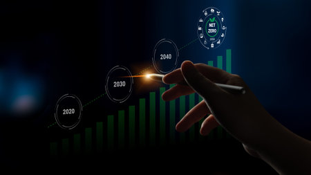 A hand reaches out towards a digital chart showing progress towards net zero emission goals,...