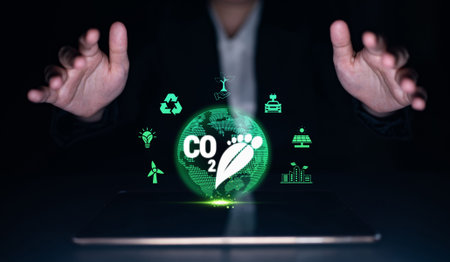 Hands Gesturing Around Digital Globe Highlighting Carbon Footprint and Eco-Friendly Icons with...