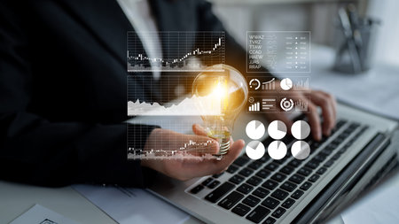 Business professional conducts financial analysis with innovative strategies represented by a light...