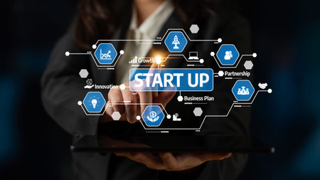 A business professional demonstrates key start-up concepts using a digital tablet, highlighting...