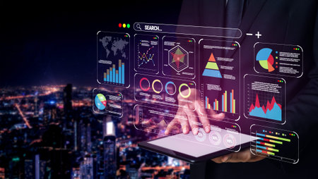 Businessman Using Digital Tablet to Display Data Visualization and Analytics with City Skyline at...