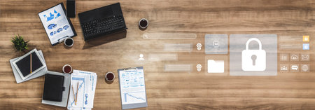 A modern office scene featuring a laptop, documents, and data security icons. Ideal for themes of...