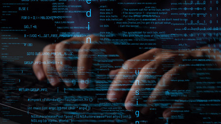 Close-up of hands actively typing on a laptop keyboard, surrounded by illuminated code and digital...