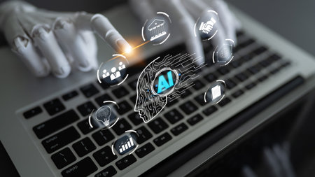 Futuristic robotic hand interacting with AI technology icons over a laptop keyboard, showcasing...