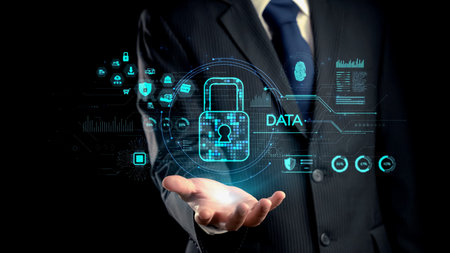 A businessman presents a digital concept of data security featuring a lock symbol against a modern...