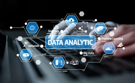 Close-up of hands typing on a laptop with data analytics icons above, illustrating important...