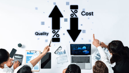 Team members analyze data trends focused on improving quality and reducing costs in a collaborative...