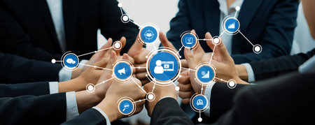 A group of business professionals engages in a collaborative digital marketing strategy session,...