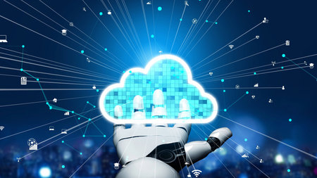 A robotic hand displays a glowing cloud icon surrounded by technology symbols, representing the...