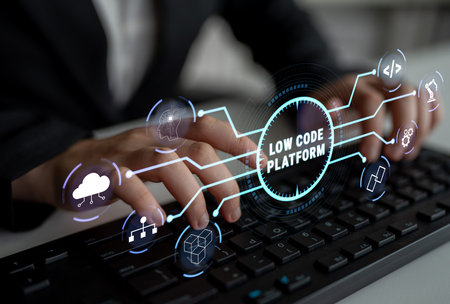 Modern Business Professional Engaging with Low Code Platform Technology Using Keyboard and Interface...