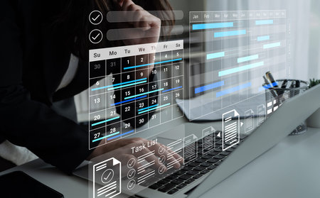 A sleek laptop displays a modern digital workspace featuring a calendar and task list, enhancing...