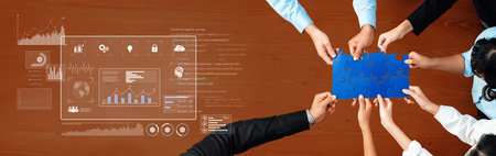 A modern office scene showcasing diverse hands working together on a blue puzzle piece while data...