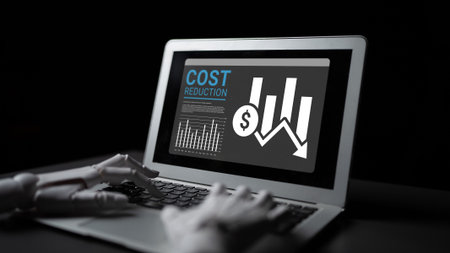 A robotic hand interacts with a laptop screen displaying financial data and cost reduction...