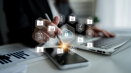 A business professional utilizes modern devices to enhance digital security and cloud technology,...