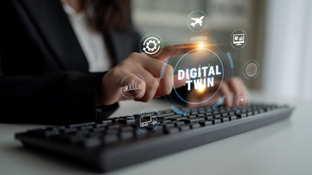 Professional hand touching keyboard showcasing digital twin concept with overlays of technology...