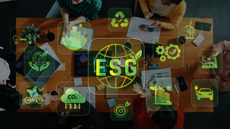 A diverse team engages in a collaborative meeting focused on environmental, social, and governance...