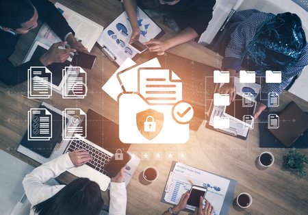 A top-down view of a dynamic office space showcasing teamwork and technology in secure document...