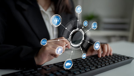 A business professional interacts with a keyboard, surrounded by floating icons that symbolize...