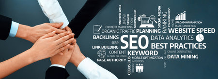 This stock image illustrates teamwork with hands coming together, symbolizing collaboration in SEO...
