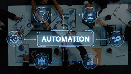 A top-down view of business professionals discussing automation strategies, showcasing data charts and technological insights in a modern office setting. Raster