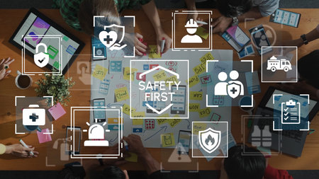 Safety First Concept with Diverse Team Collaborating on Project Over Table with Icons and Symbols Representing Health and Security. Entropy.