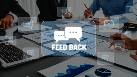 A team engages in a collaborative feedback session, analyzing charts and data in a modern office, aiming to enhance their business strategies and performance. Raster