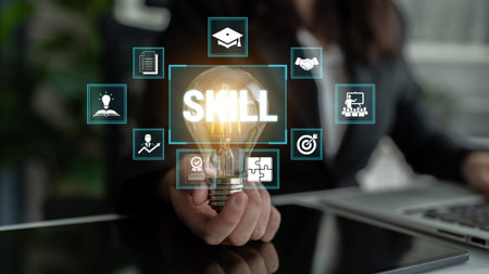 A Person Holding a Light Bulb Symbolizing Skill Development with Educational Icons in the Background for Inspiration and Growth in Professional Fields Fluxor.