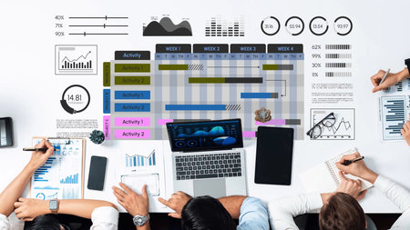 Business Team Collaborating on Data Analysis and Project Management Visuals, Displaying Charts, Graphs, and Timelines for Effective Strategy Planning. Entropy.