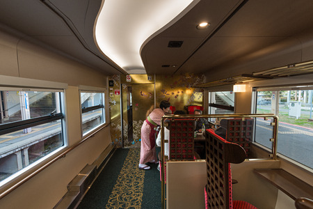 ISHIKAWA,JAPAN-APRIL 8,2016:Interior of the "Hanayome Noren" train. The 2nd car adopt designs often used in local lacquer-ware. Doors and ceiling detailing like gold leaf and cherry blossom pattern.のeditorial素材