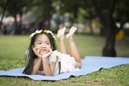 Little asian girl in parkの写真素材