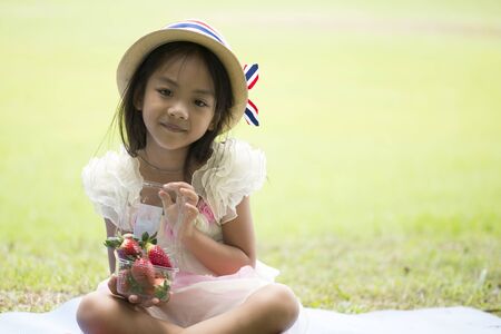 Little asian girl in parkの写真素材