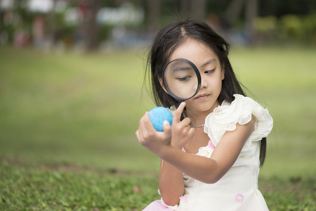 Little asian girl in parkの写真素材