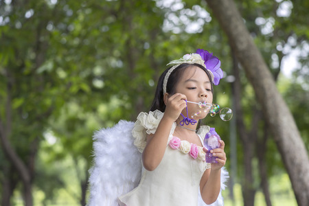 Little asian girl in parkの写真素材