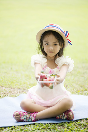 Little asian girl in parkの写真素材