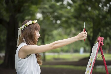 beautiful young woman in parkの写真素材