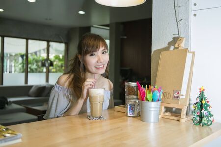 Beatiful women in a coffee shopの写真素材