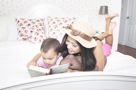 Mom and Little boy using mobile phone at homeの写真素材